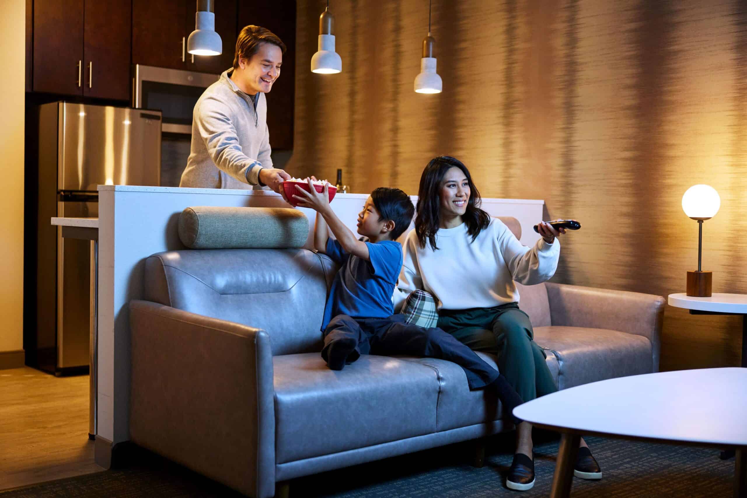 Family watching a movie in-room